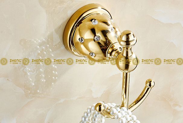 Obrázek k výrobku 3084 - Držák na ručníky "kotva" zlatý 2-114-5201